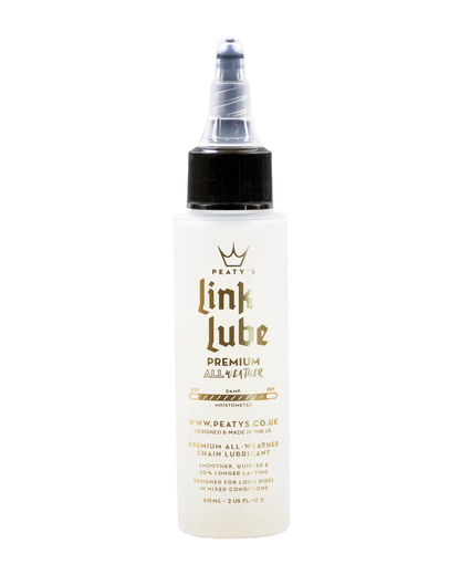 Hvid Peaty's Linklube Premium kædeolie i 60 ml flaske med sort låg og gennemsigtig tud.